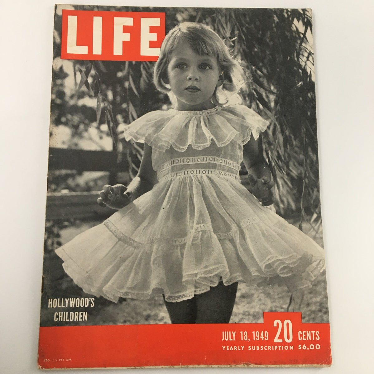 VTG Life Magazine cover from July 18, 1949 featuring Hollywood Child Sharon Harmon, depicting a young girl in a white dress, emphasizing the theme of Hollywood's children, newsstand edition.