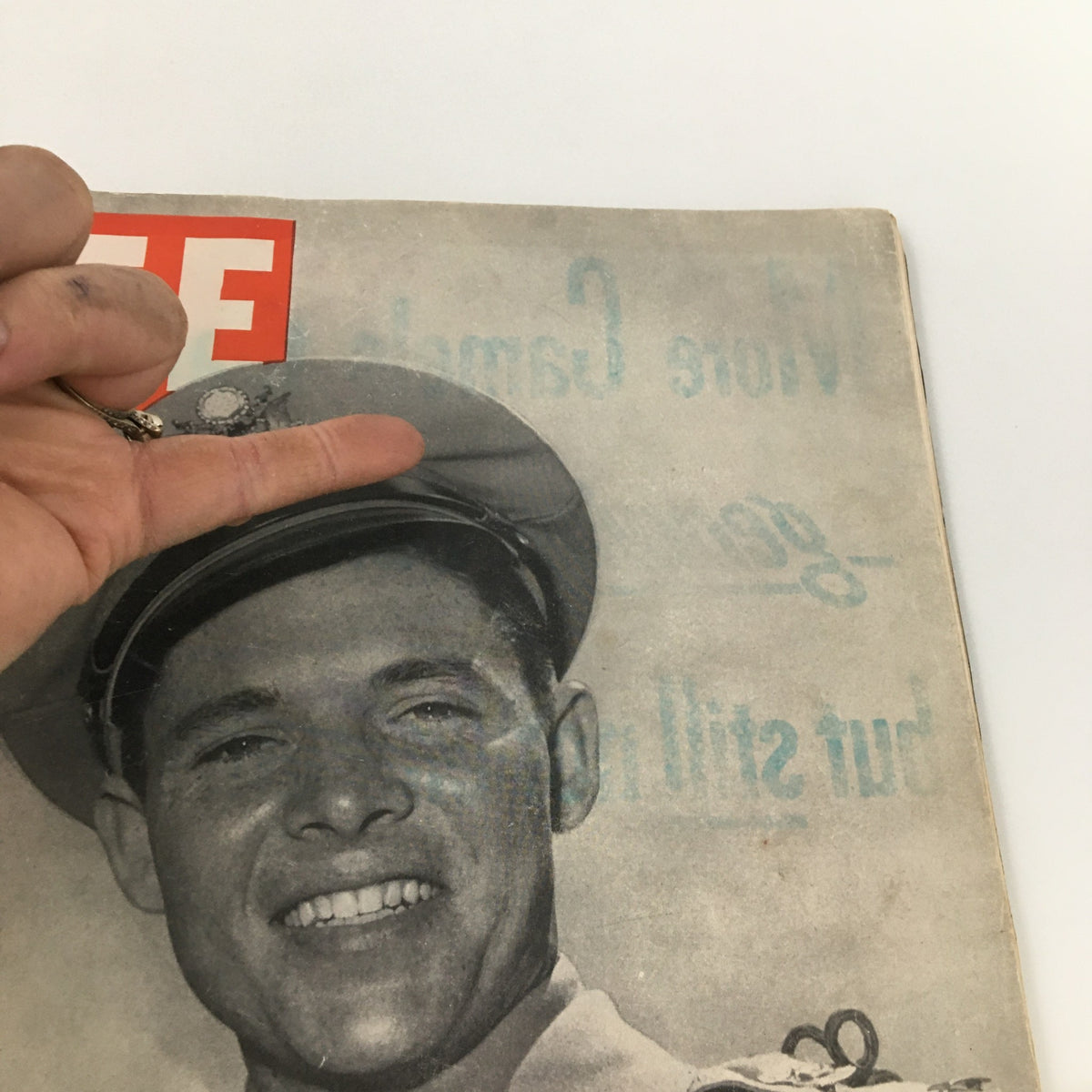 Close-up of the cover of VTG Life Magazine July 16 1945 featuring Audie Murphy, showcasing the magazine's title and a smiling soldier in a military uniform.
