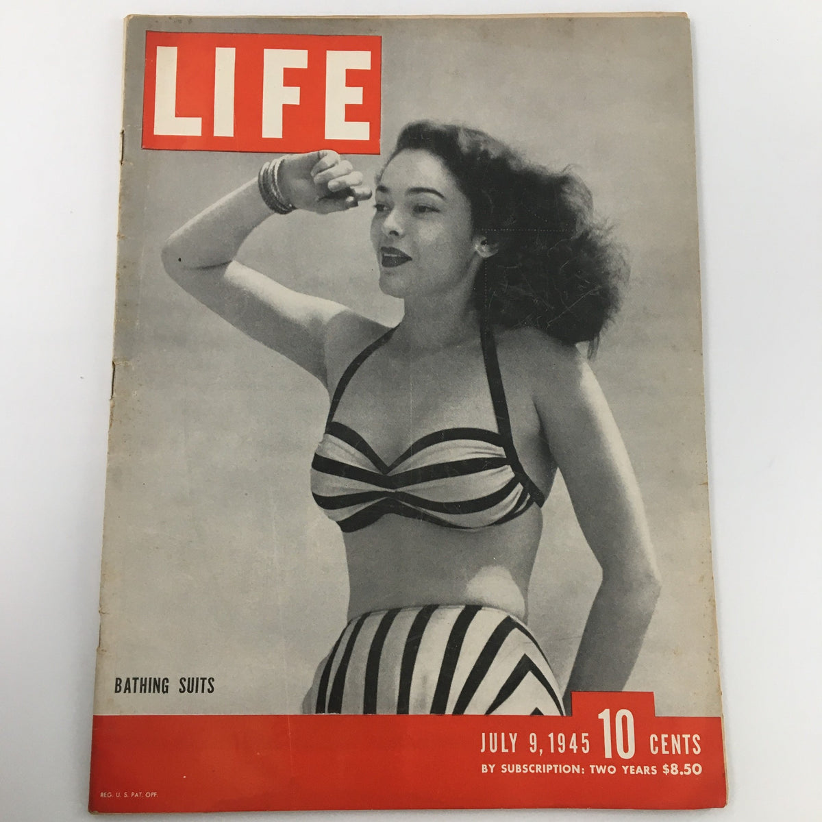 Vintage Life Magazine July 9 1945 featuring a glamorous model in a striped bathing suit on the cover, highlighting mid-20th century summer fashion.