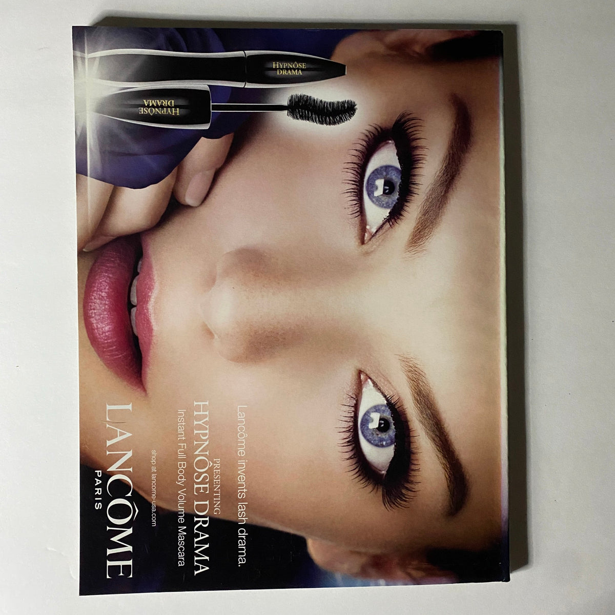 Lancôme advertisement in W Magazine May 2010 presenting the Hypnôse Drama mascara, highlighting beauty and cosmetics in a visually striking manner.