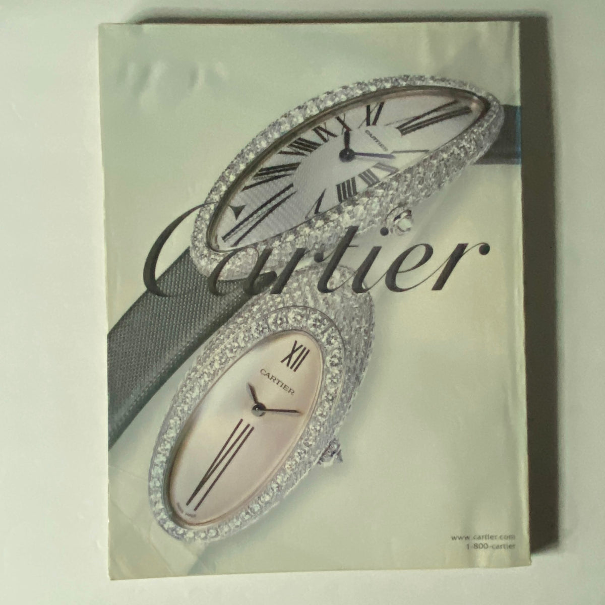 W Magazine November 2002 Cover featuring an elegant Cartier watch advertisement, highlighting luxury timepieces from the brand.