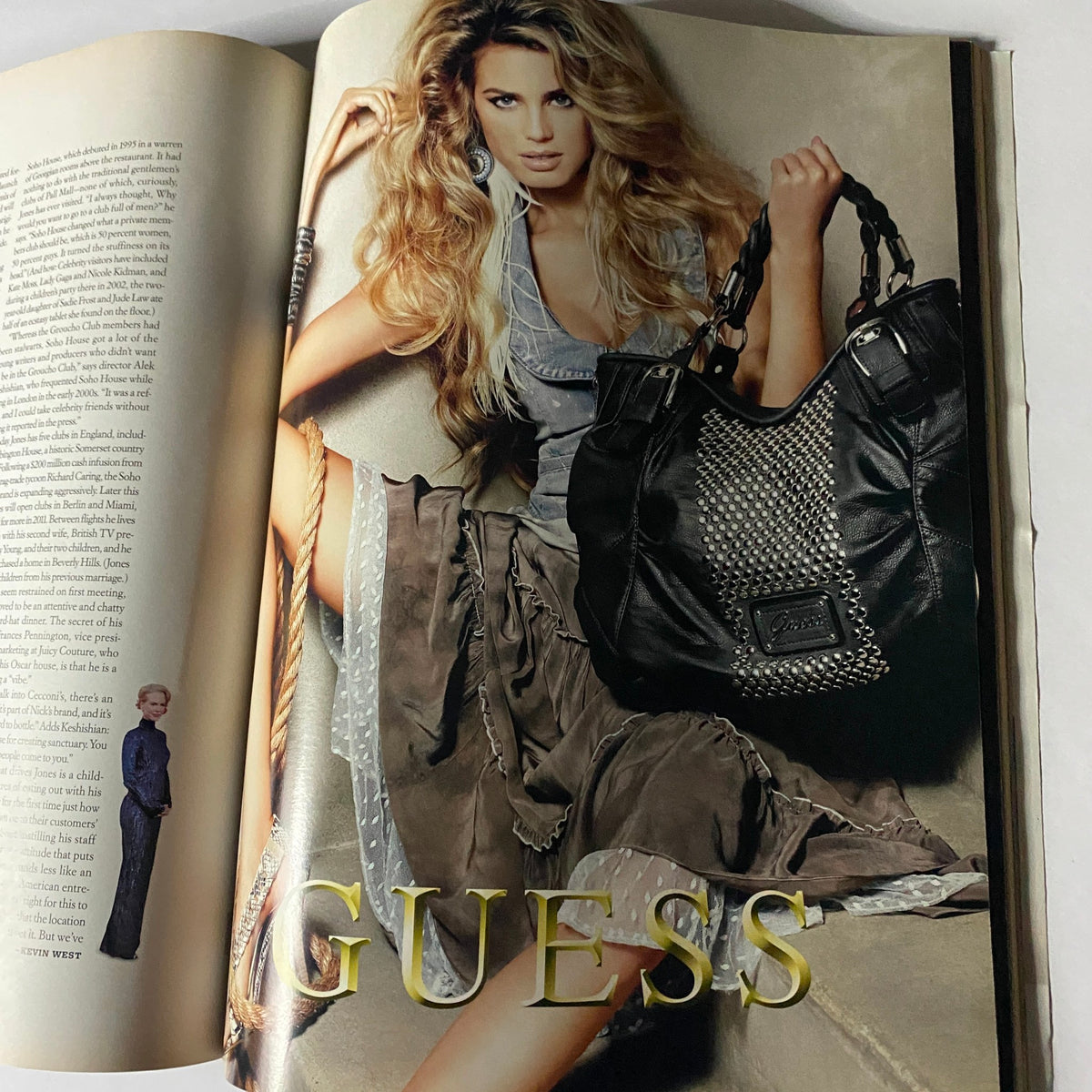 W Magazine March 2010 issue showcasing a Guess advertisement with a model in a stylish outfit holding a handbag.