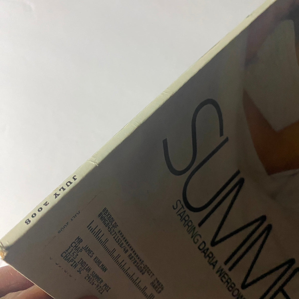 Close-up view of the spine of W Magazine July 2008, showcasing the publication date and the title 'SUMMER CAMP' starring Daria Werbowy, Kate Moss, and Lara Stone.