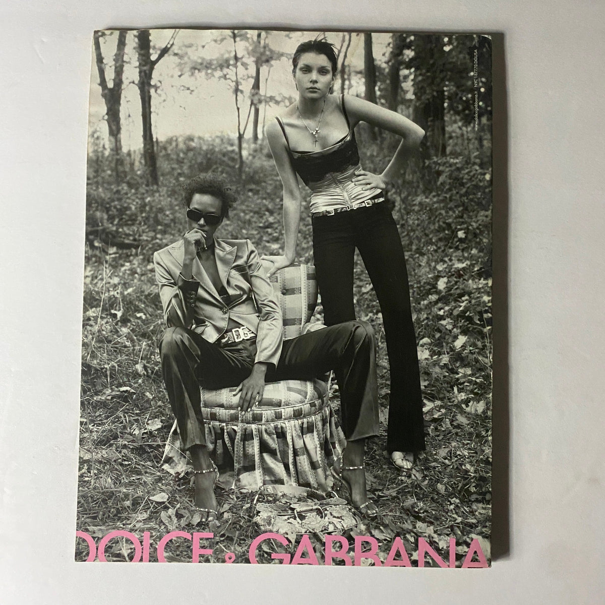 W Magazine January 2004 Gisele Bündchen Cover VG featuring a striking black and white photograph of a fashion shoot with two models, one seated on a vintage chair and the other posing standing, reflecting contemporary fashion trends.
