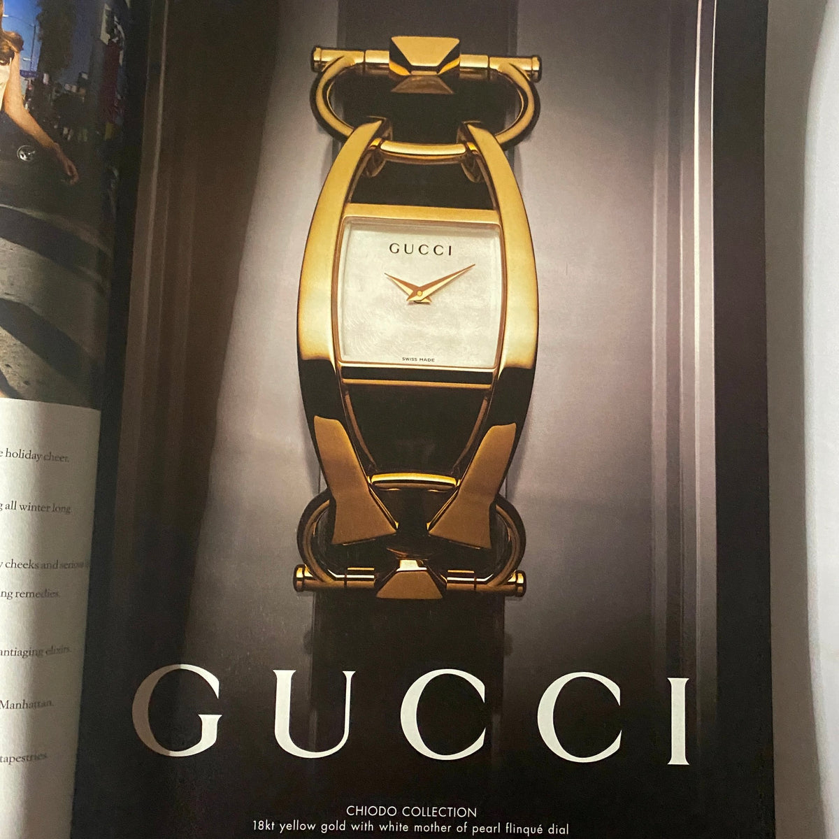 Advertisement page for Gucci from W Magazine December 2008, featuring a luxurious gold watch from the Chiodo collection, emphasizing high fashion and luxury branding.
