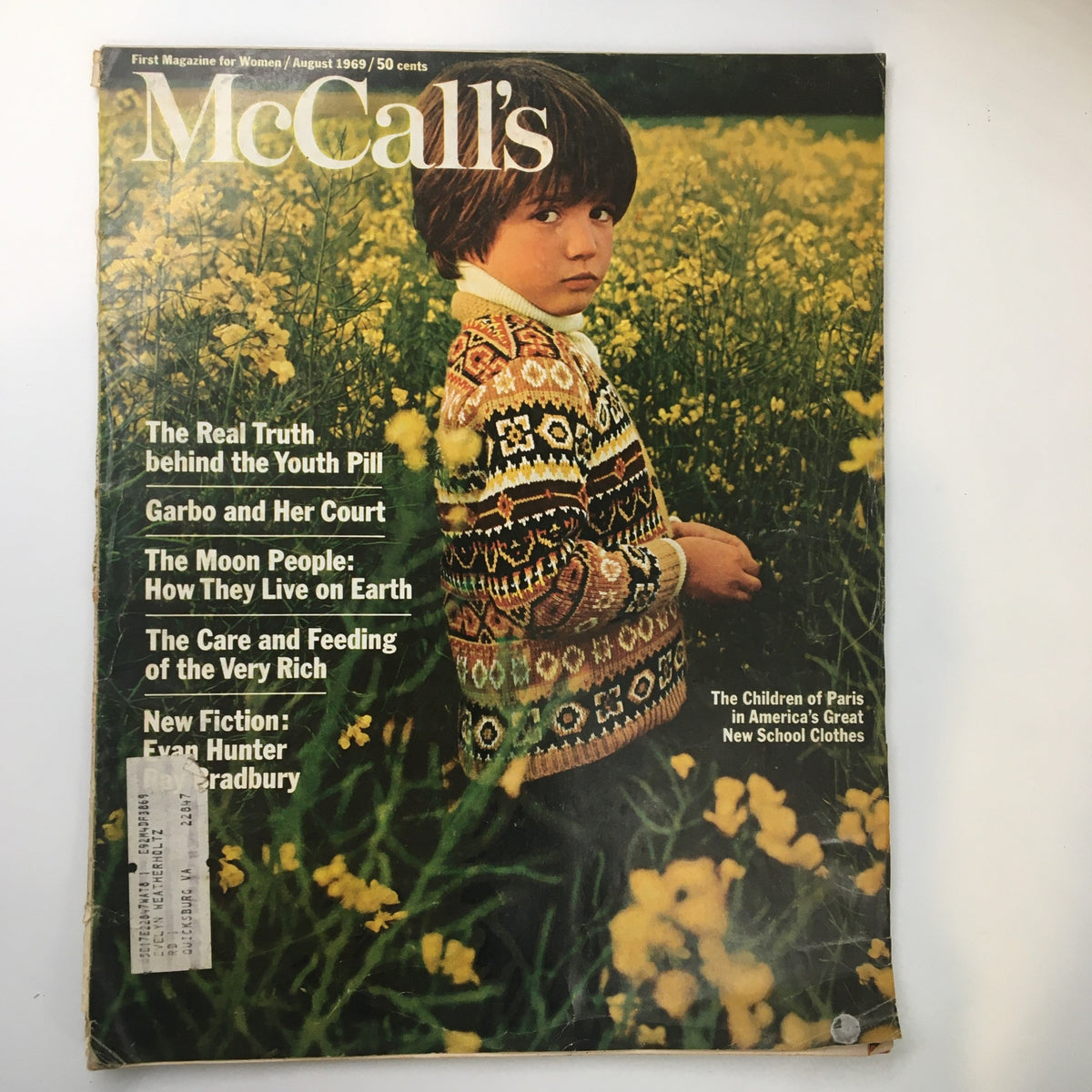 Front cover of VTG McCall's Magazine August 1969 featuring the headline 'The Real Truth Behind The Youth Pill' with a boy in a field of yellow flowers.