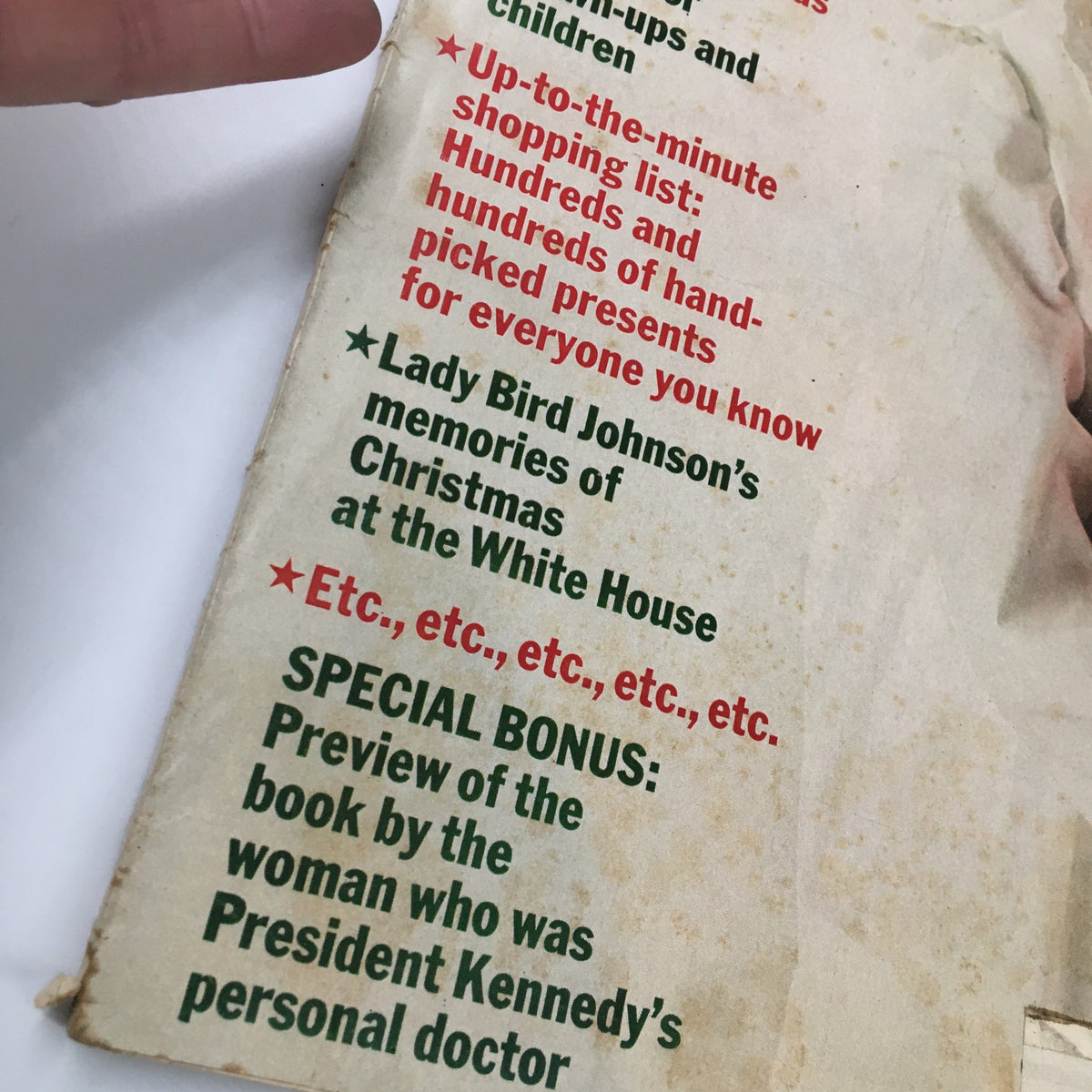Close-up of the VTG McCall's Magazine December 1968 cover text detailing features of the issue, including Lady Bird Johnson's memories of Christmas and holiday shopping lists.