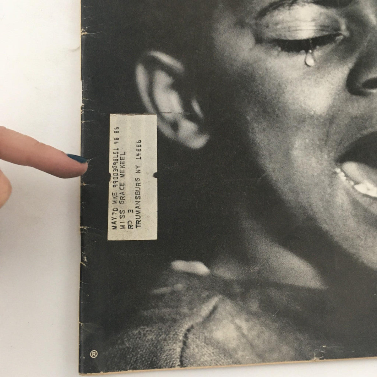 Close-up image of a vintage Life Magazine from March 8, 1968, titled 'The Negro and the Cities, Cry That Will Be Heard.' The image features a person's finger pointing at a label affixed to the magazine's cover, showcasing the magazine's age and authenticity.