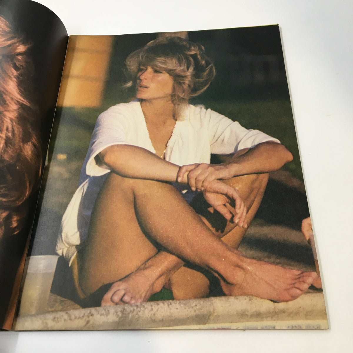 An inside image from the VTG TV Superstar Magazine October 1977 photo album, depicting Farrah Fawcett in a casual pose, capturing the essence of 1970s glamor.