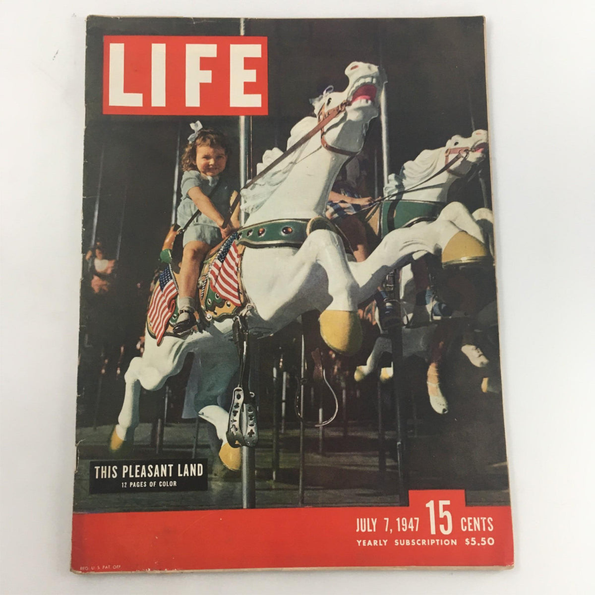 Cover of VTG Life Magazine July 7, 1947 featuring a carousel with a girl riding a horse in colorful imagery, promoting the article 'This Pleasant Land'.