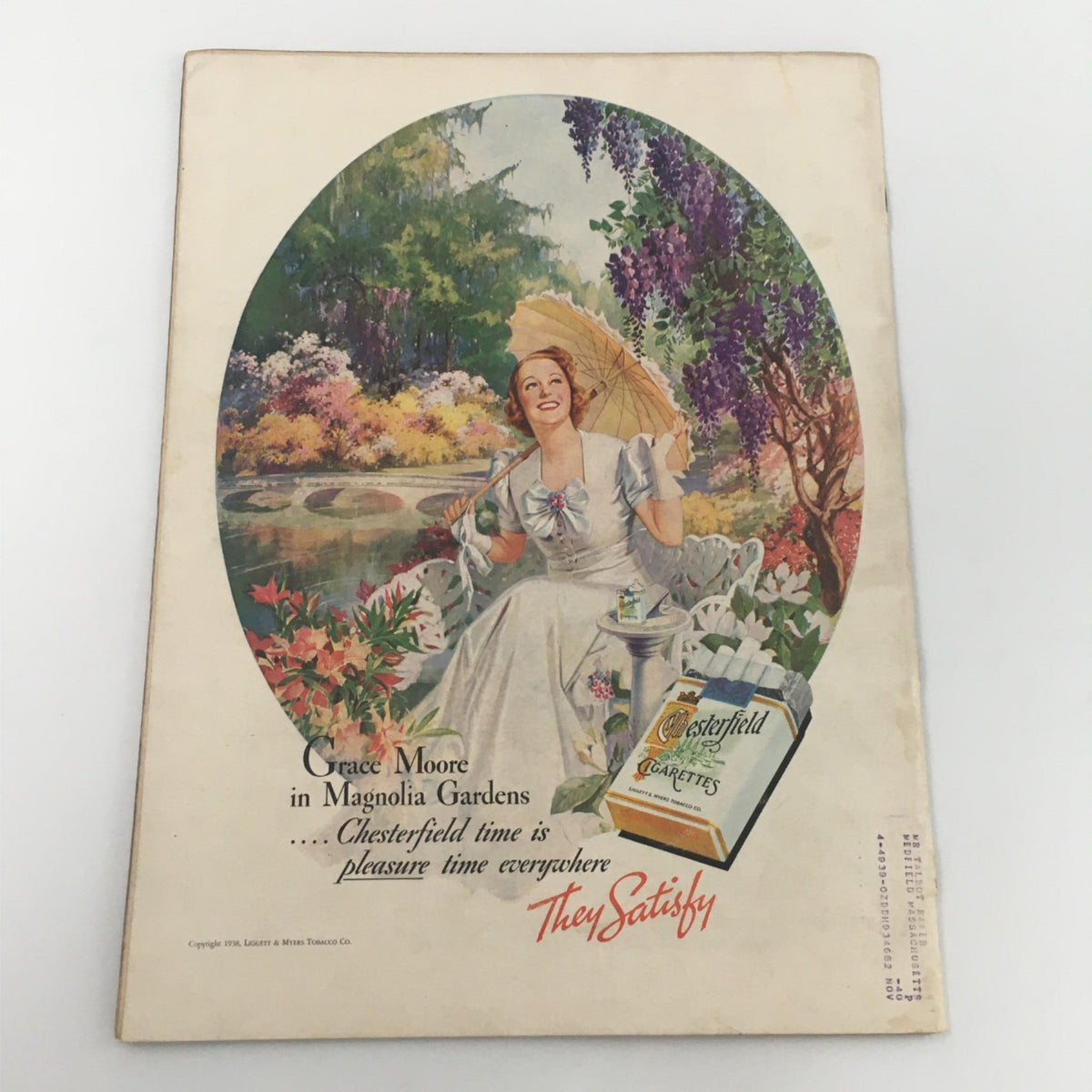 Vintage advertisement featuring Grace Moore in Magnolia Gardens, promoting Chesterfield Cigarettes. Captured in a colorful outdoor setting, the ad highlights vintage styles from the era of Life Magazine July 11, 1938.