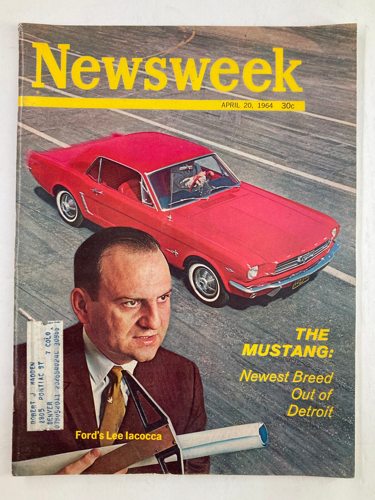Vintage Newsweek Magazine from April 20, 1964, featuring Ford's Lee Iacocca and the Mustang; cover showcases bright red Mustang on the track with Iacocca holding a paper, highlighting the launch of this iconic car.