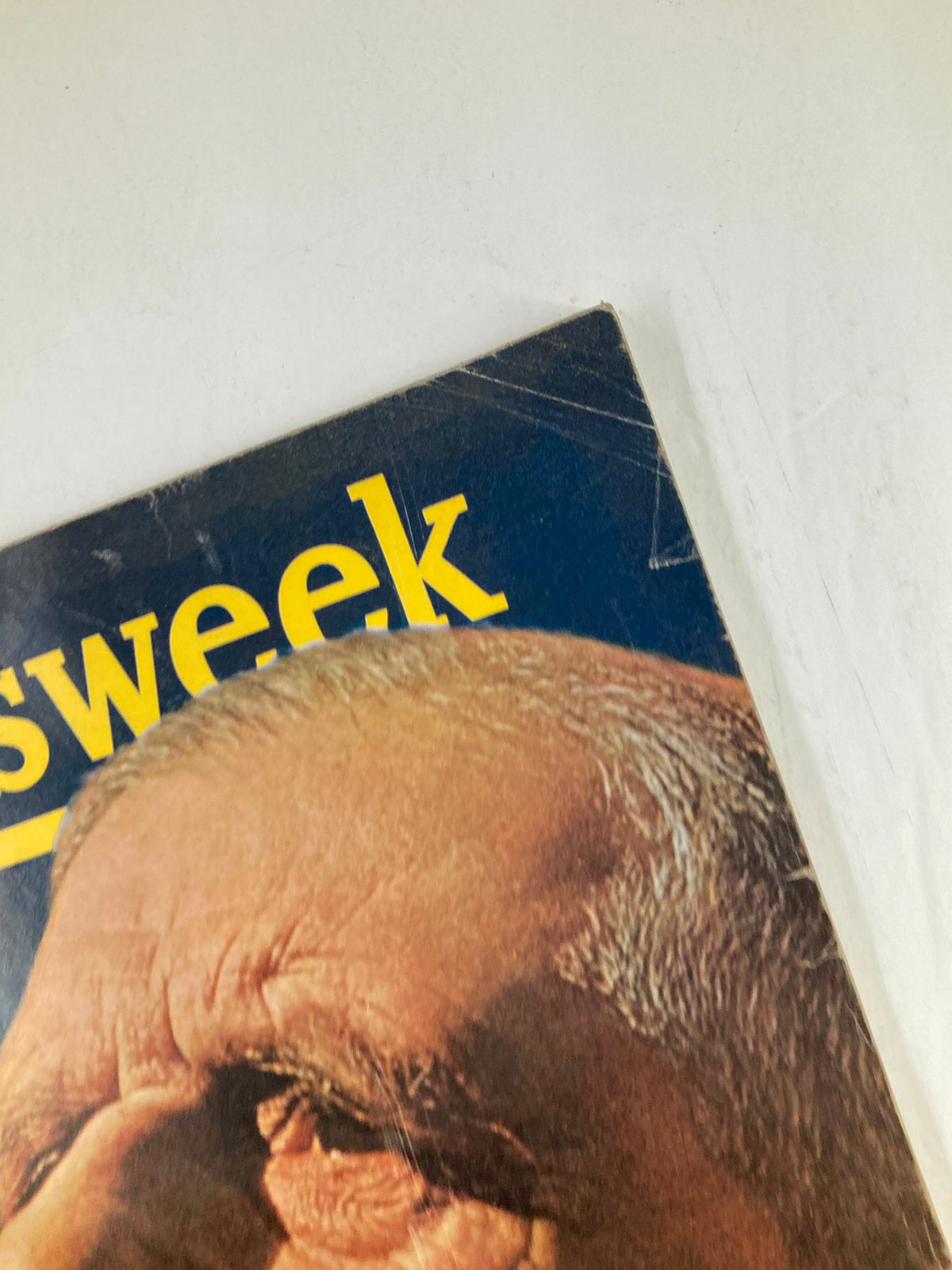 Close-up view of the Vintage Newsweek Magazine from February 10, 1964, focusing on the upper corner showing the title and a portion of the cover image featuring Charles de Gaulle.