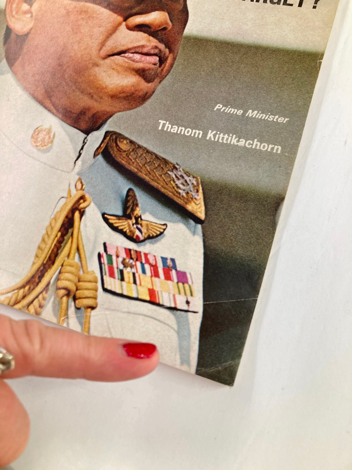 Close-up of the vintage Newsweek magazine cover dated January 31, 1966, highlighting Prime Minister Thanom Kittikachorn, showcasing military decorations and a finger pointing at the details.