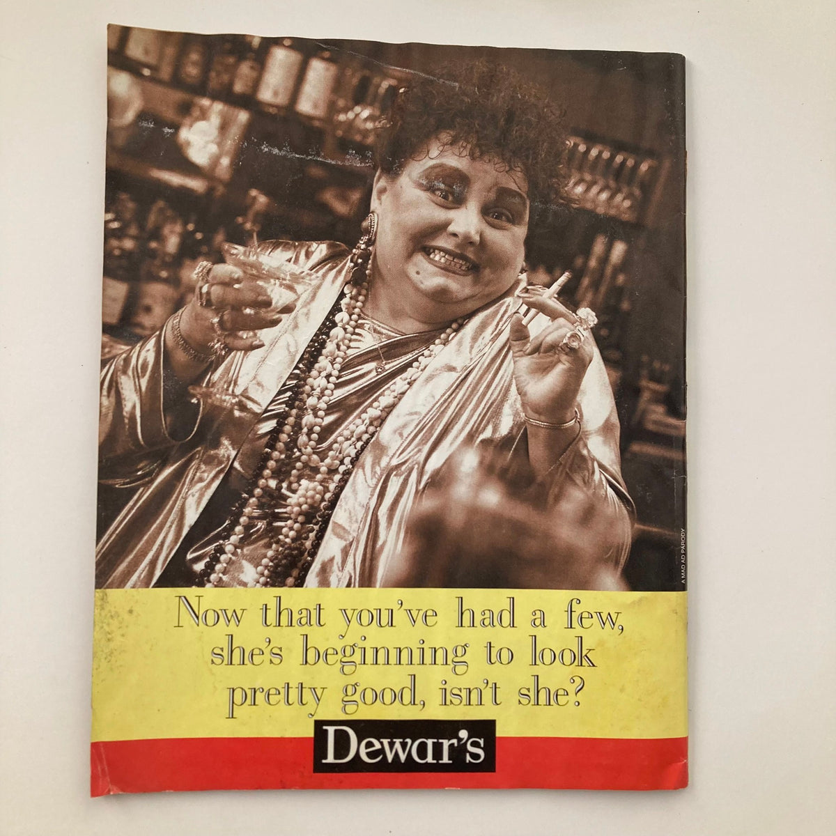 Back cover of Mad Magazine June 1997 #358 featuring a vintage advertisement for Dewar's whiskey with a humorous tag line.