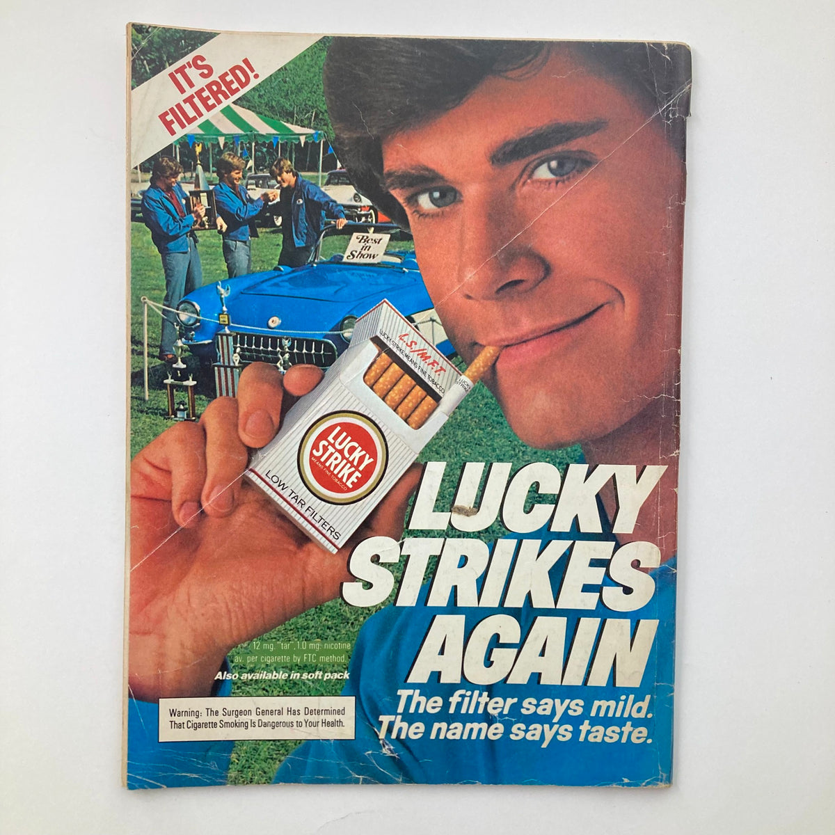 Cover of the Vintage National Lampoon Magazine April 1984 featuring an advertisement for Lucky Strike cigarettes, emphasizing the phrase 'The filter says mild. The name says taste.'