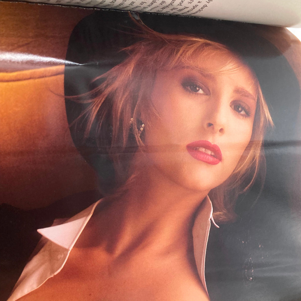 Playboy Magazine January 1990 interior page featuring a glamorous photo of a model with a hat, highlighting the bold and artistic photography of the era.