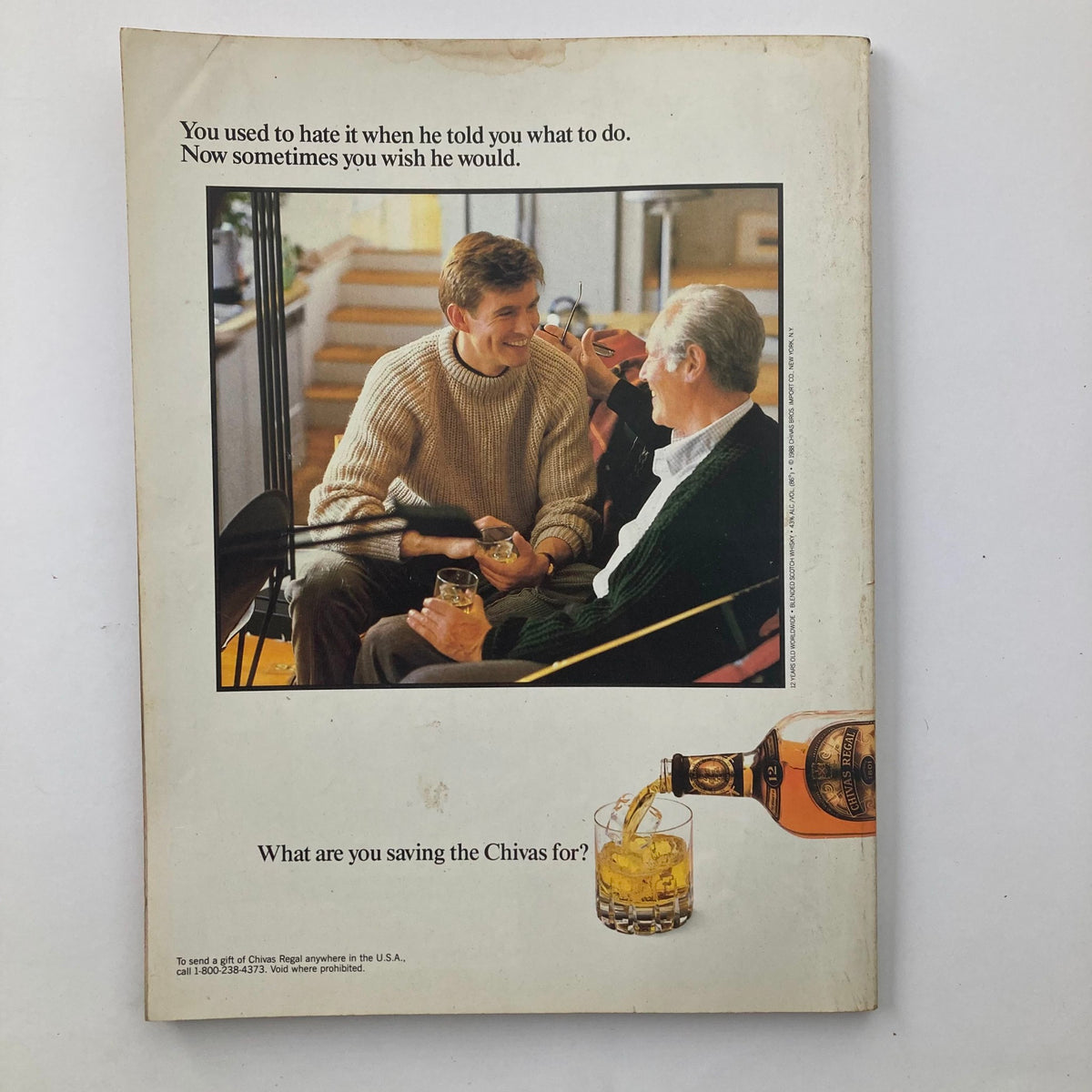 Back cover of VTG Playboy Magazine June 1989 featuring an advertisement for Chivas Regal whiskey, depicting a warm moment between a father and son.