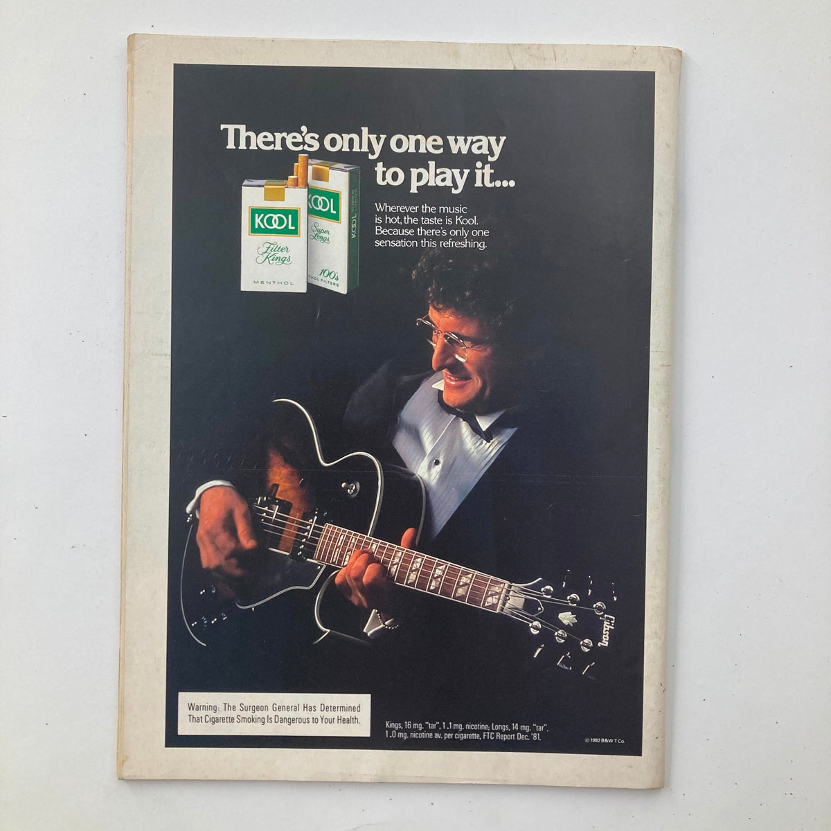 Back cover of Vintage National Lampoon Magazine April 1983 Vol 2 No 57 showing an advertisement for Kool cigarettes with a musician playing guitar.