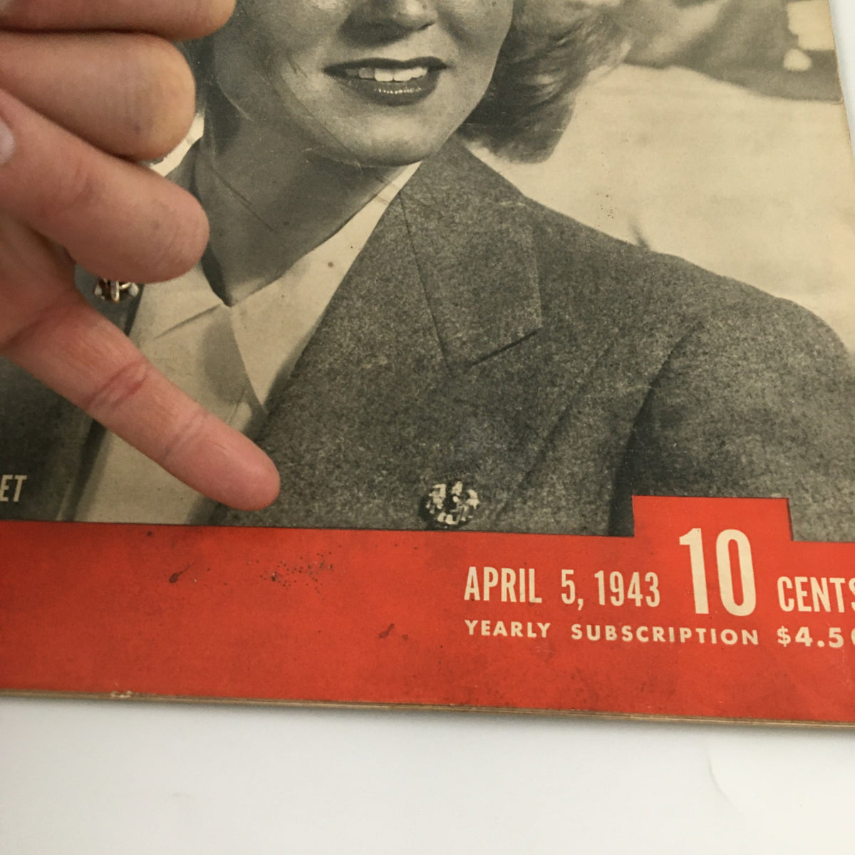 Detail of the cover of VTG Life Magazine April 5, 1943, focusing on the woman's outfit and the magazine's publication details such as date and price.