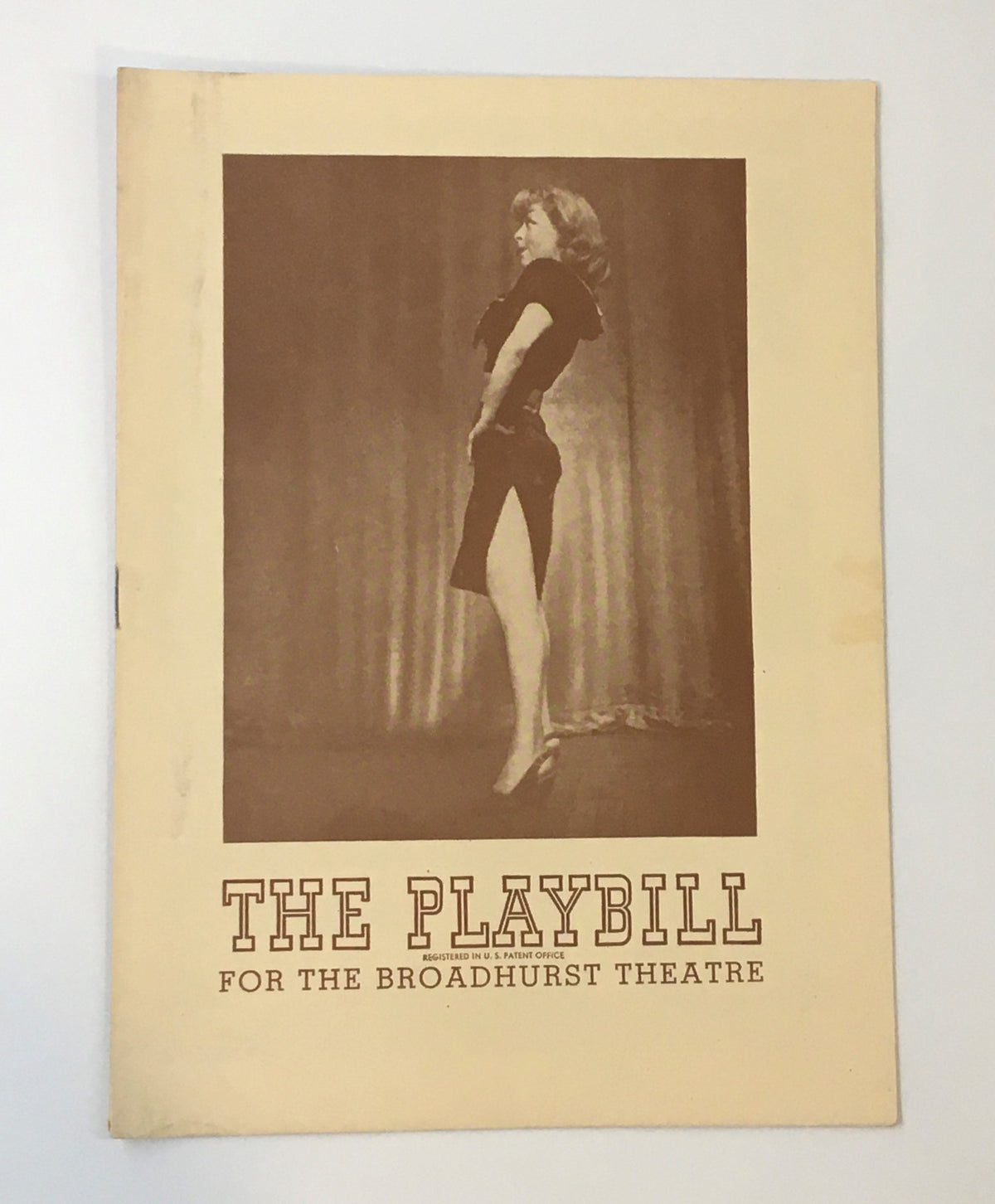 1945 Playbill for The Broadhurst Theatre featuring Follow The Girls by Harry Delmar, showcasing a vintage cover image with a performer striking a pose.