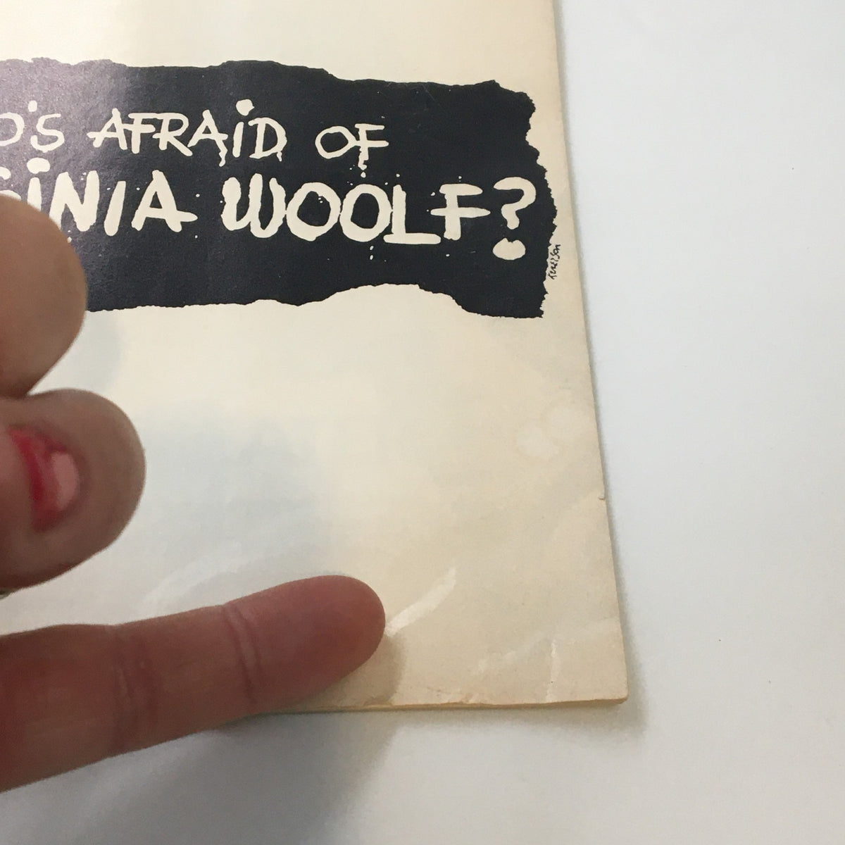 Close-up of the cover of the 1976 Playbill for Edward Albee's 'Who's Afraid of Virginia Woolf?' showcasing the iconic title typography.