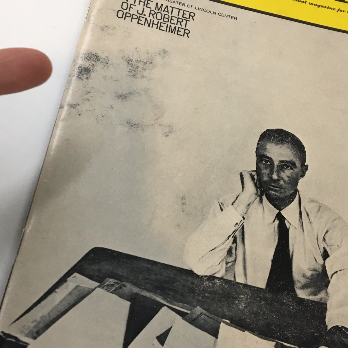 Close-up of the 1969 Playbill 'In The Matter of J. Robert Oppenheimer' from The Colonial Theatre, highlighting minor wear and the subject resting his chin on his hand.