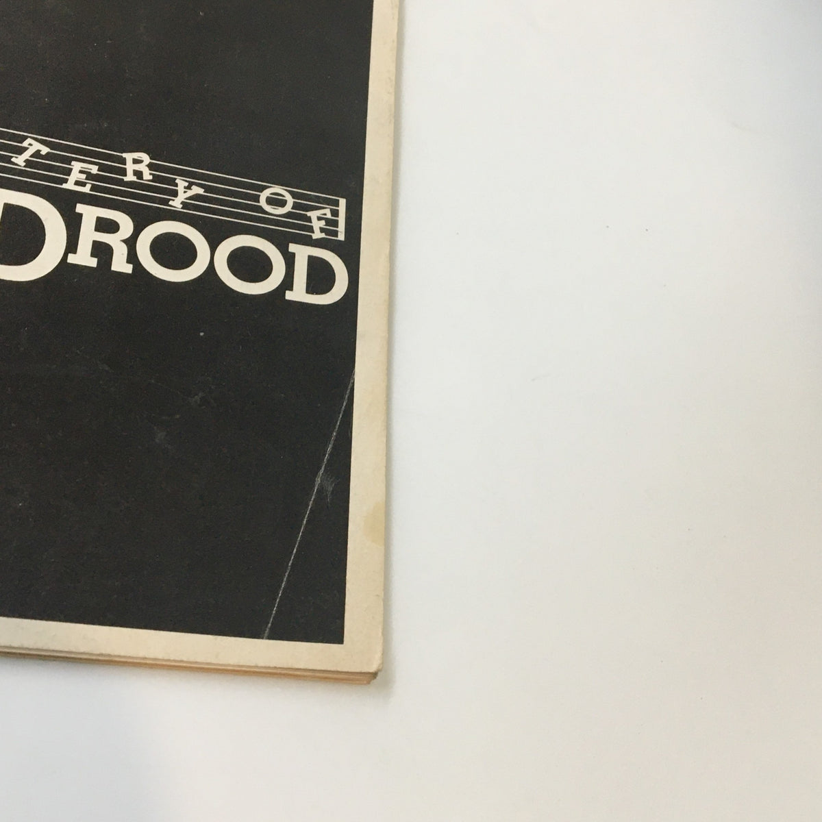 Side view of the 1986 Playbill for The Mystery of Edwin Drood, showcasing the play's distinctive black and white design.