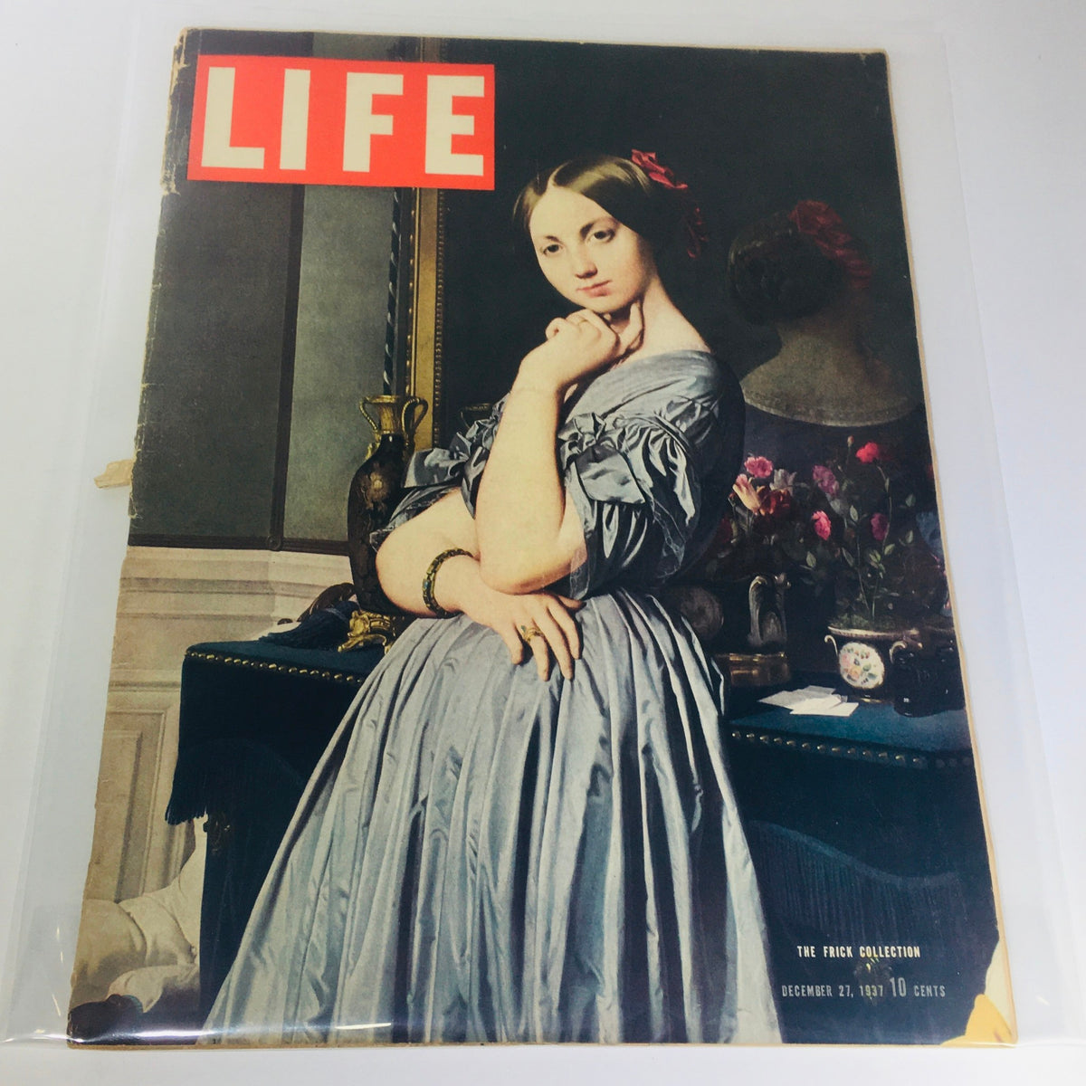Cover of Vintage Life Magazine from December 27, 1937 featuring The Frick Collection, showcasing a beautiful woman in a grey dress against an elegant background.