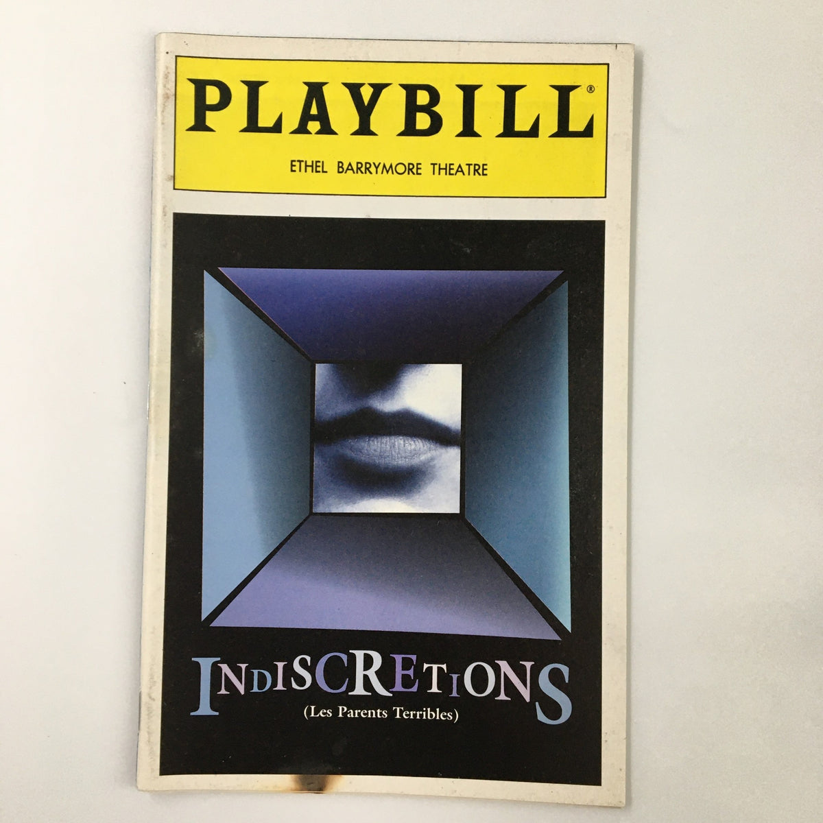 1995 Playbill featuring Kathleen Turner in Indiscretions at Ethel Barrymore Theatre, showcasing a unique cover design with a cube graphic and theatrical theme.