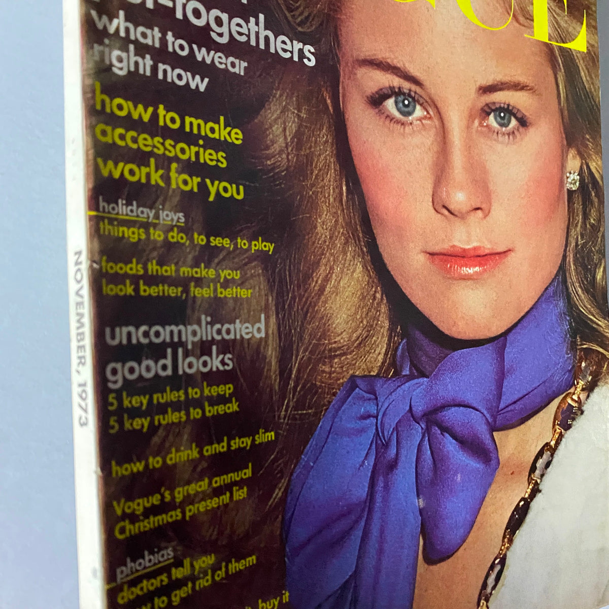Detailed view of Vogue Magazine November 1973 cover showcasing Cybill Shepherd, with emphasis on fashion tips and styling.