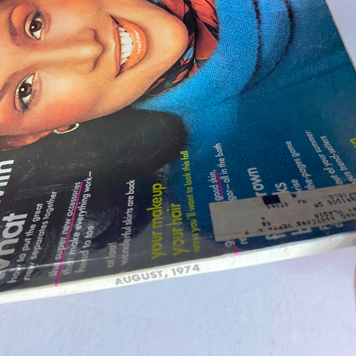 Close-up of the Vogue Magazine August 1974 cover with Beverly Johnson, highlighting her fashion-forward look and the bold title displayed prominently.