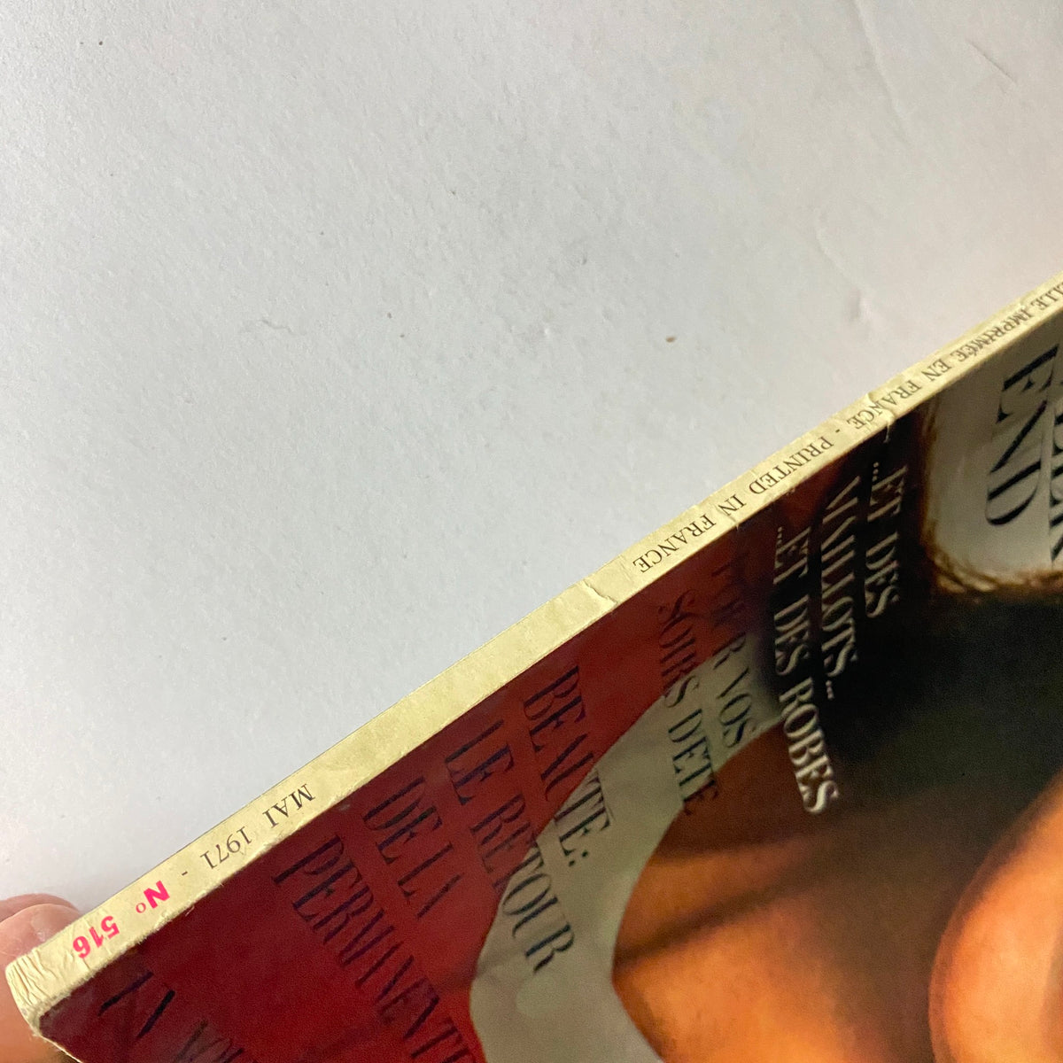 Close-up side view of Vogue Paris Magazine May 1971 Ali MacGraw Cover No Label with a focus on the magazine spine and edge details, including the publication date May 1971.