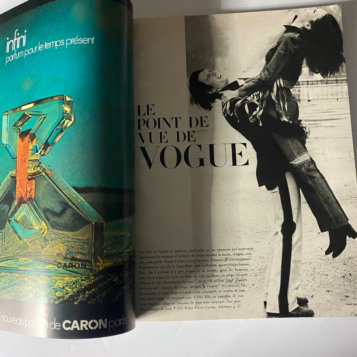 Inside view of the Vogue Paris Magazine May 1971 featuring a colorful perfume advertisement for 'Infini' and a page titled 'Le Point de Vue de Vogue' with black and white photography.