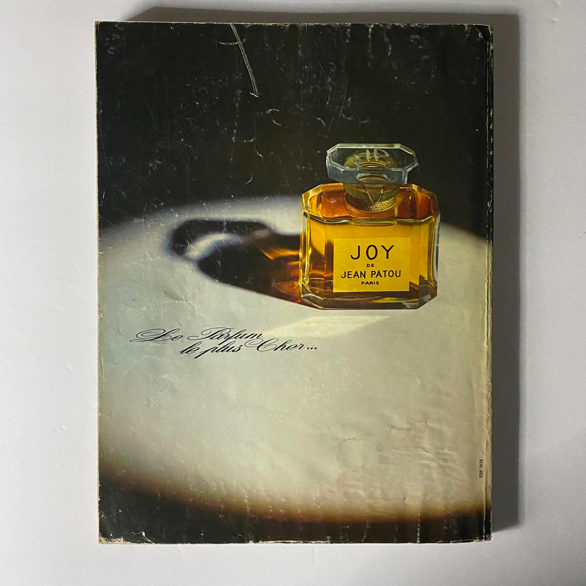 Back cover of Vogue Paris Magazine March 1971 featuring a vintage perfume advertisement for 'Joy de Jean Patou,' emphasizing luxury and elegance.