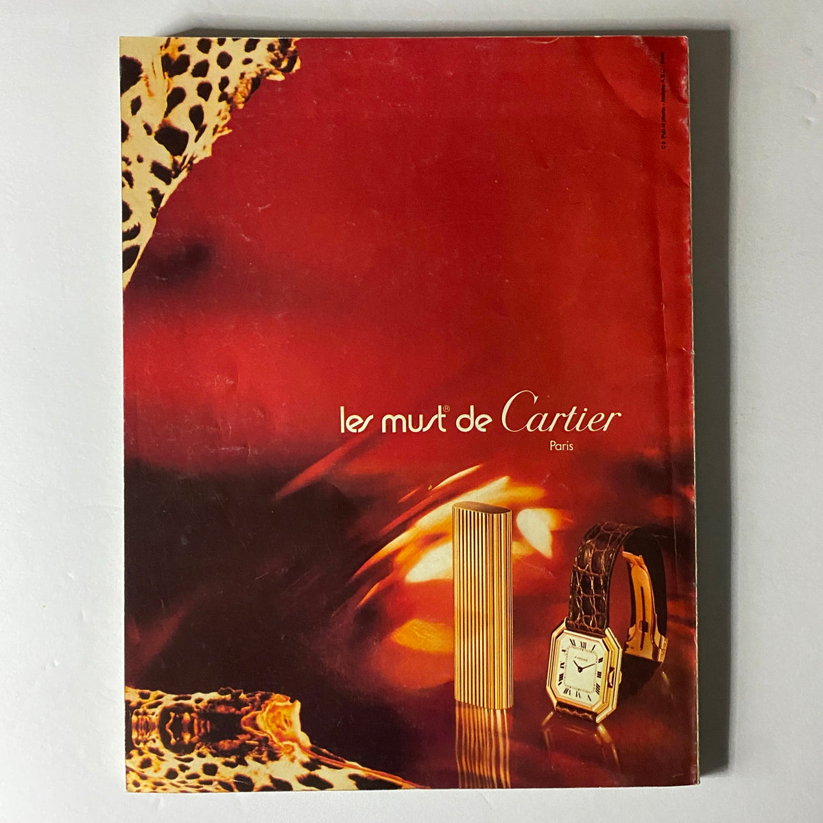 Ad page from Vogue Paris Magazine August 1975 featuring Cartier products, reflecting luxury advertising trends of the 1970s.