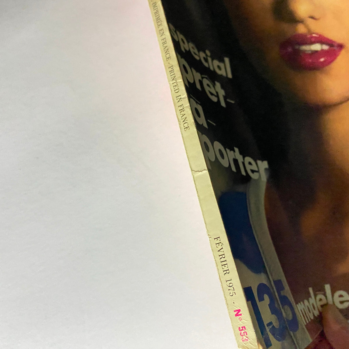 Close-up of the spine of Vogue Paris Magazine February 1975, highlighting the edition details and the 'special pret-à-porter' focus, reflecting the fashion trends of the mid-1970s.
