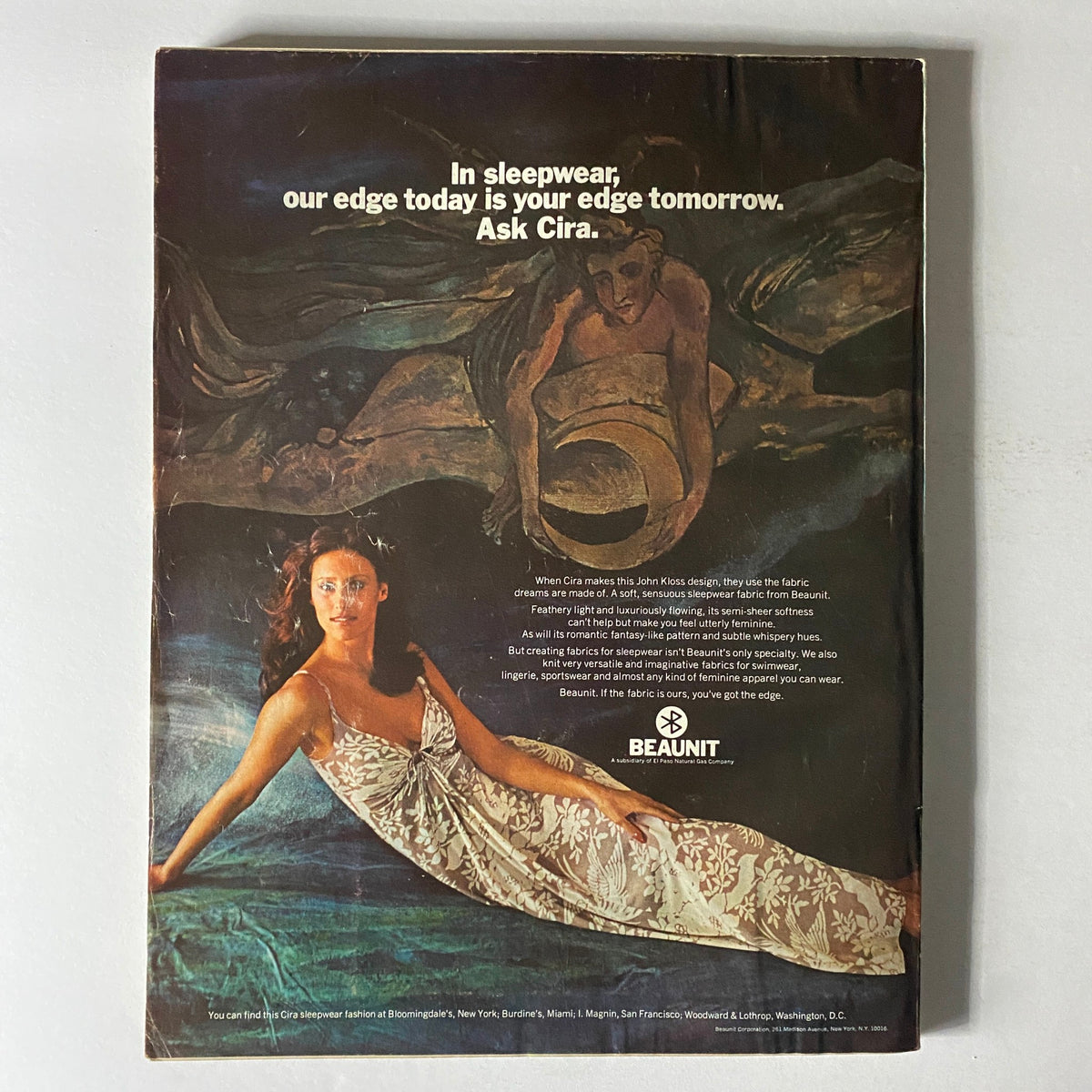 Vogue Magazine December 1973 Jacqueline Bisset Cover back featuring an advertisement for Cira sleepwear, showcasing a model in a floral nightgown with a captivating artistic background, emblematic of fashion advertising in the 1970s.