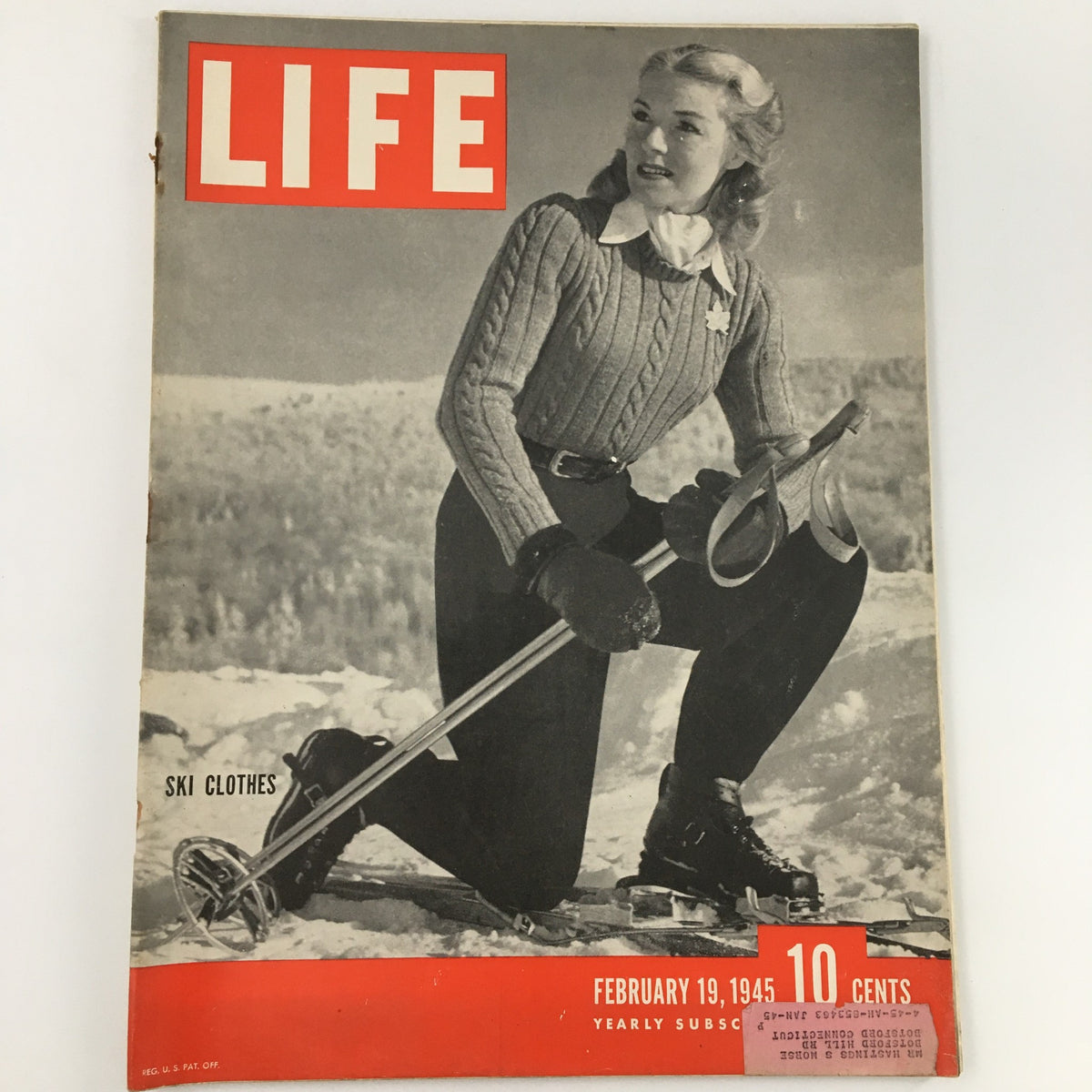 Vintage Life Magazine February 19, 1945 featuring ski clothes on the cover, showcasing 1940s winter fashion with a model in a stylish outfit and skis.