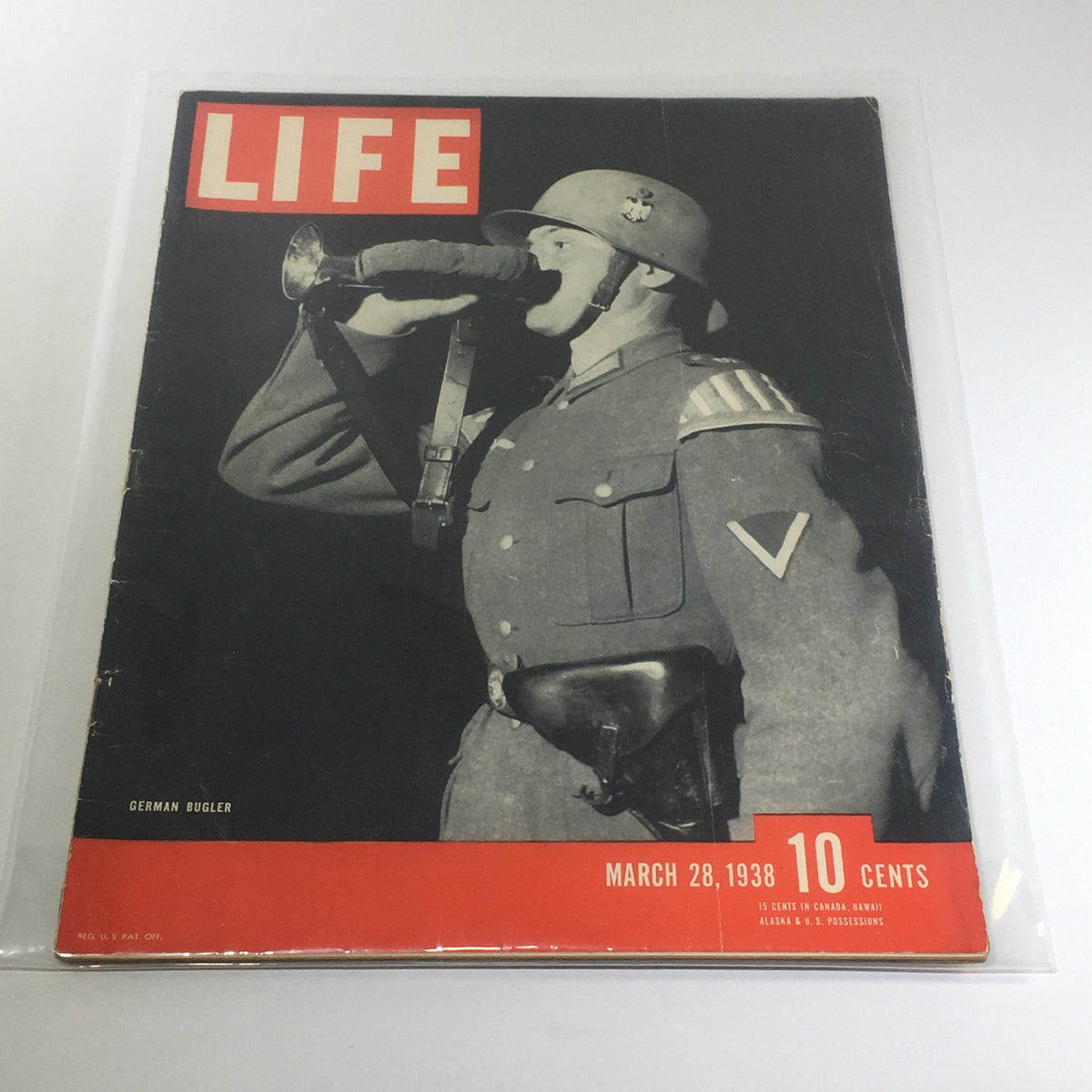Vintage Life Magazine cover from March 28, 1938, featuring a German Bugler in military uniform, emphasizing historical significance and vintage appeal.