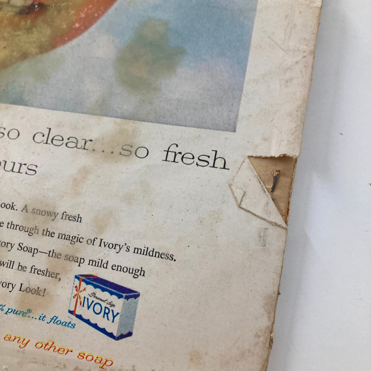 Detail shot of an old advertisement showcasing a baby and Ivory Soap, highlighting its gentle qualities, from the December 1957 VTG Modern Screen Magazine.