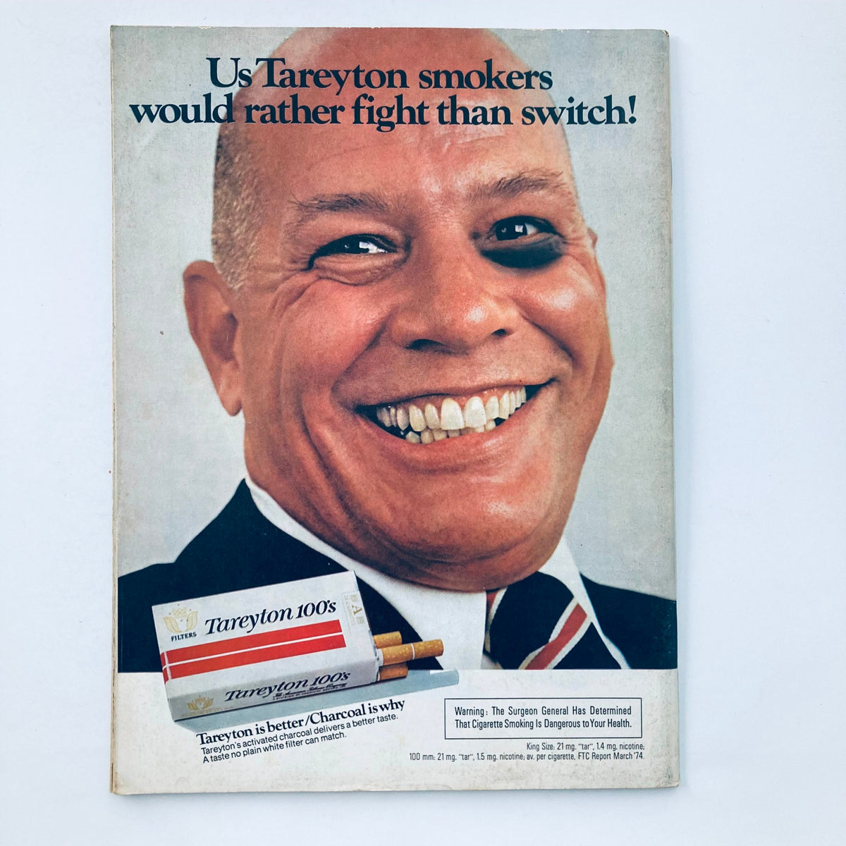 Cover of the Vtg National Lampoon Magazine September 1974, Vol 1 No 54, 'Safari Safety', featuring an advertisement for Tareyton cigarettes with a smiling man and the slogan 'Us Tareyton smokers would rather fight than switch!'.