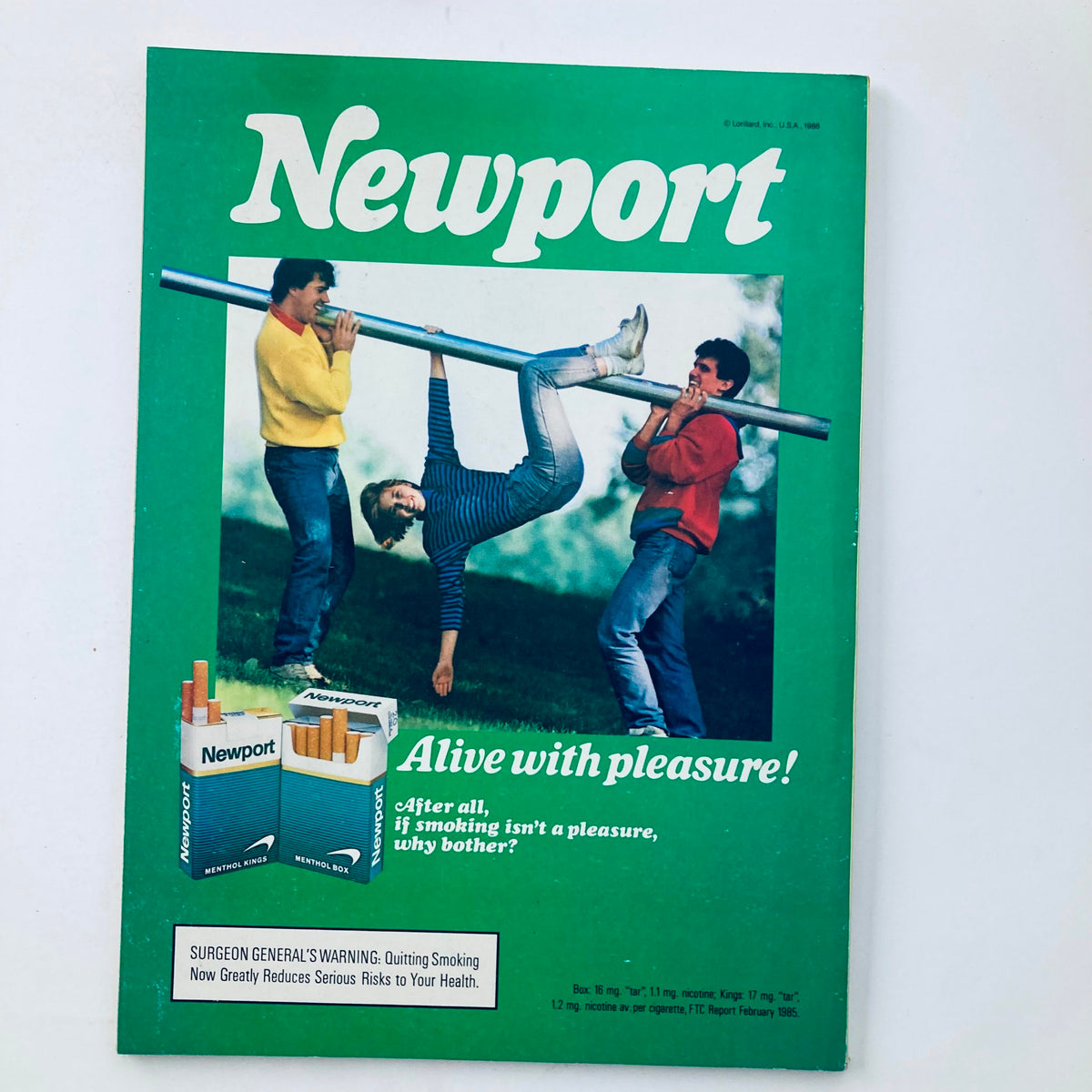 Cover image of a Newport advertisement featuring three people interacting with a pole, promoting the slogan 'Alive with pleasure!' in a colorful 1988 design, reflecting the playful spirit of the era.