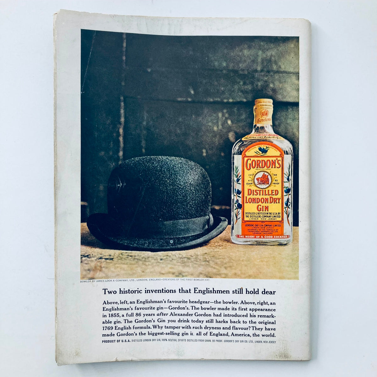 Back cover image of Vintage Playboy Magazine May 1963, featuring a gin advertisement next to a bowler hat.