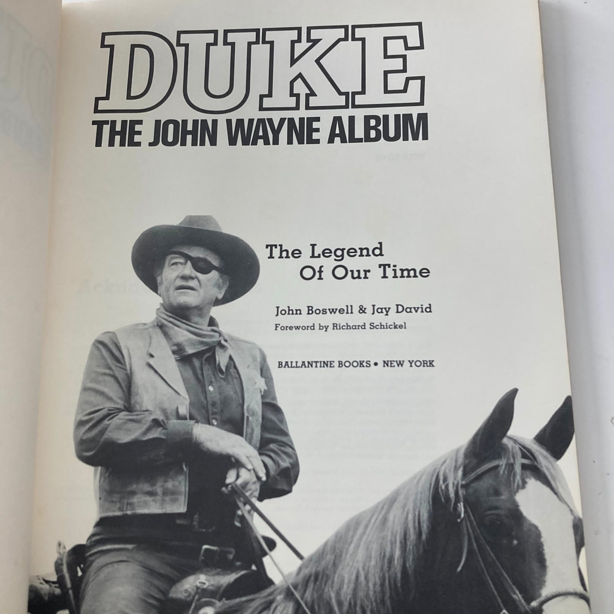 Inside page of 1979 The John Wayne Album Duke showcasing John Wayne in cowboy attire on horseback, highlighting his legendary status.
