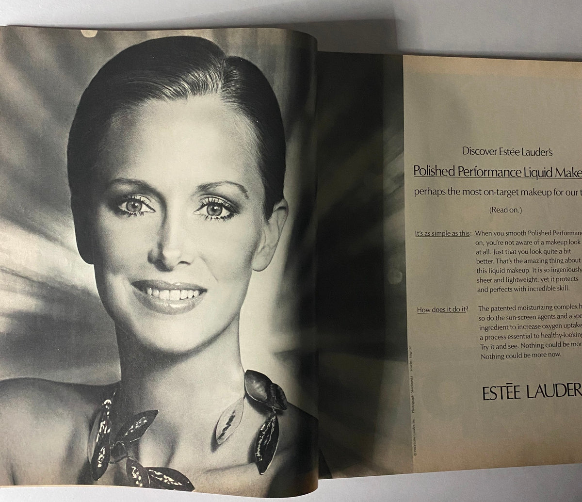 Beauty advertisement for Estée Lauder's Polished Performance Liquid Makeup featured in Harper's Bazaar Magazine February 1980.