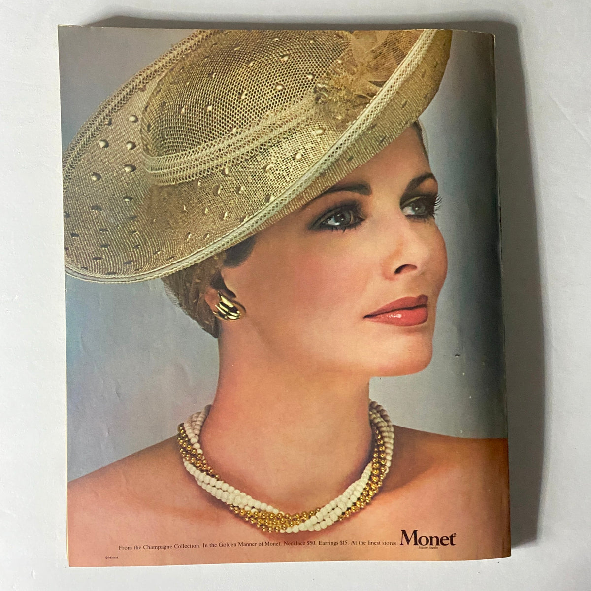 Cover image from Harper's Bazaar Magazine April 1980, highlighting a woman wearing a glamorous hat and jewelry, representing the classic beauty and fashion of the early 1980s.