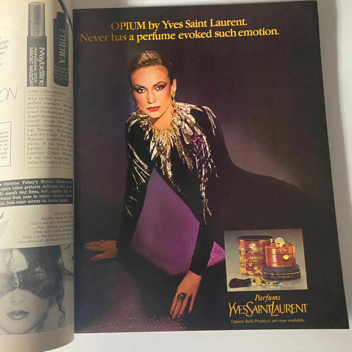 Vintage advertisement for Opium by Yves Saint Laurent featured in Harper's Bazaar Magazine May 1980 showcasing a model in a glamorous outfit with bold accents.