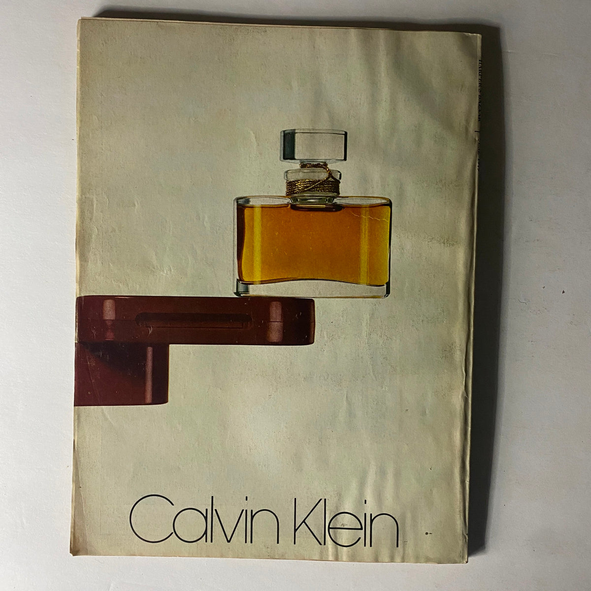 Cover of Calvin Klein advertisement featured in Harper's Bazaar Magazine June 1979 showcasing a perfume bottle design.
