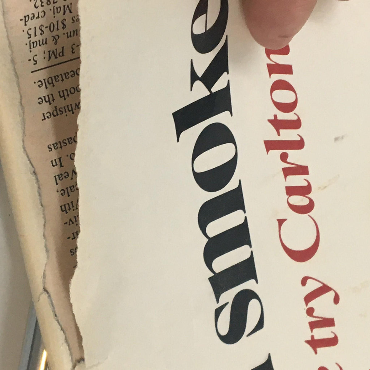Close-up of the edge of a 1985 Playbill for The Iceman Cometh by Eugene O'Neill, showing minor wear and tear.